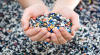 two-hands-holding-shredded-plastic-pieces.png